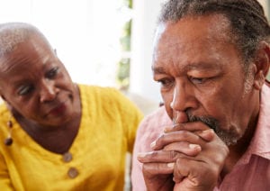 A couple appear concerned as they face the realities of onset dementia