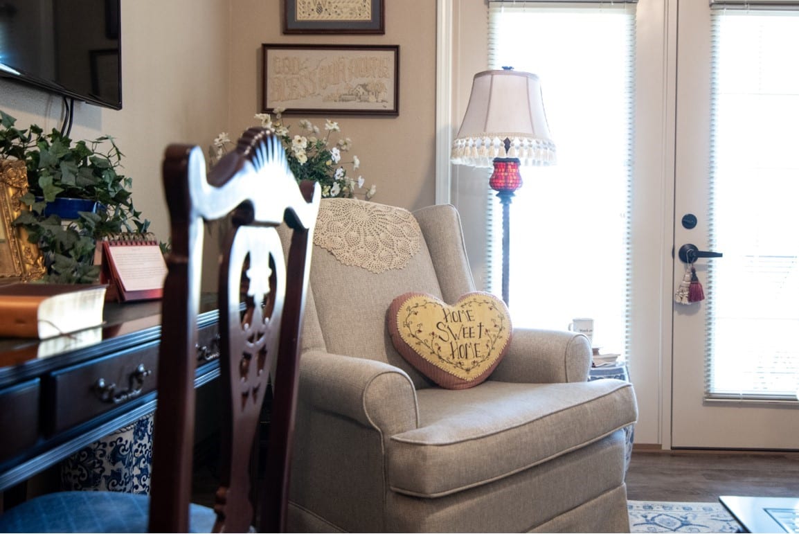 A chair and desk in a resident's room shows off the great lifestyle at Culpepper Place Assisted Living
