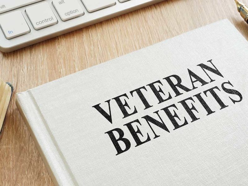 Computer Keyboard and a book about veterans benefits