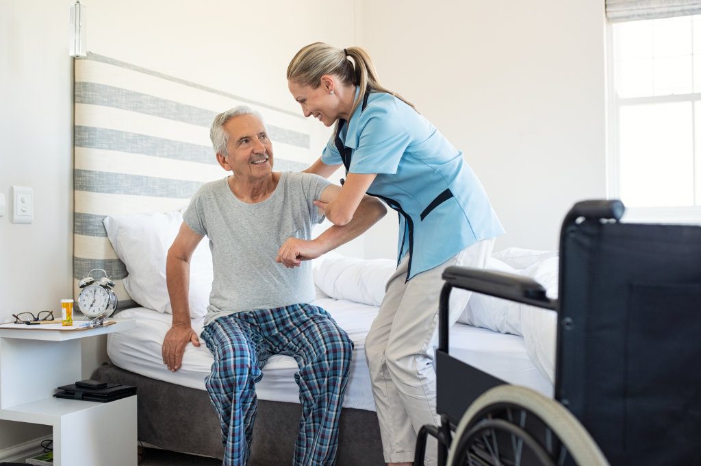 A nurse evaluates an elderly man for activities of daily living.